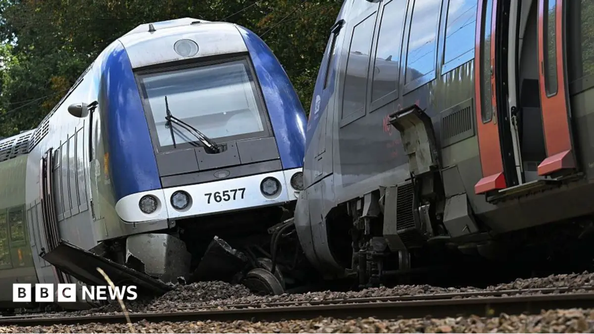French Investigators Examine Rail Fragment Following Train Derailment, 44 Injured