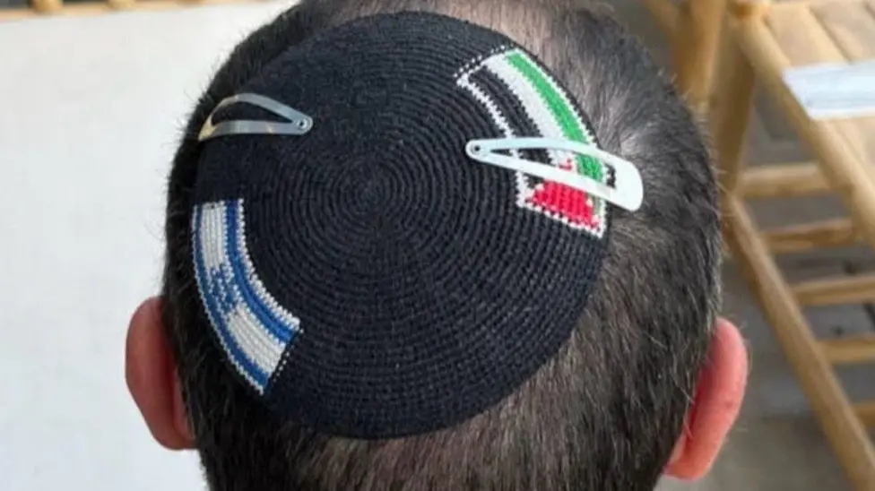 Israeli Police Detain British Academic Alex Sinclair, Cut Palestinian Flag from Kippah in Modiin